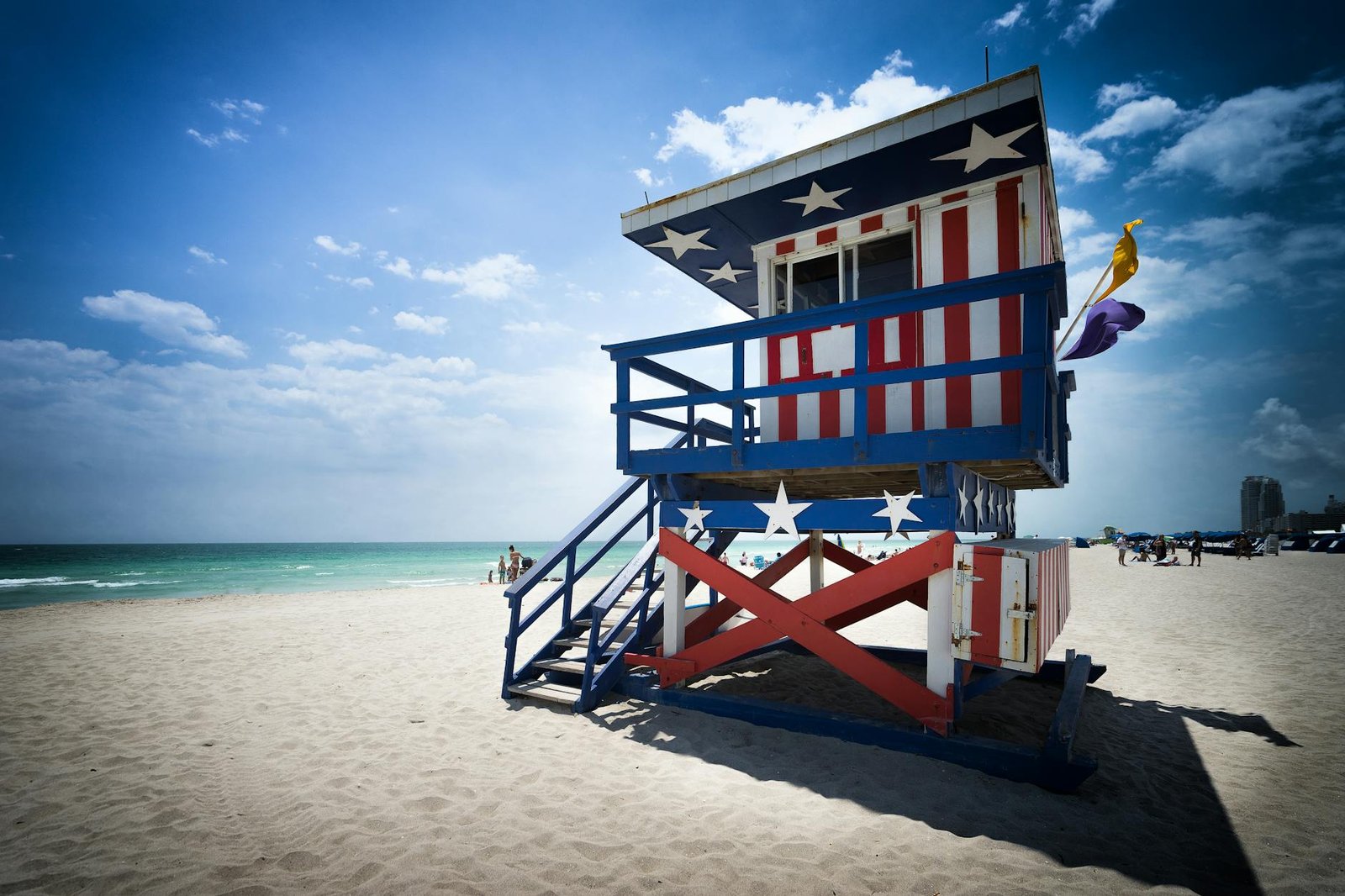 Colorful lifeguard tower with American flag design on Miami Beach.