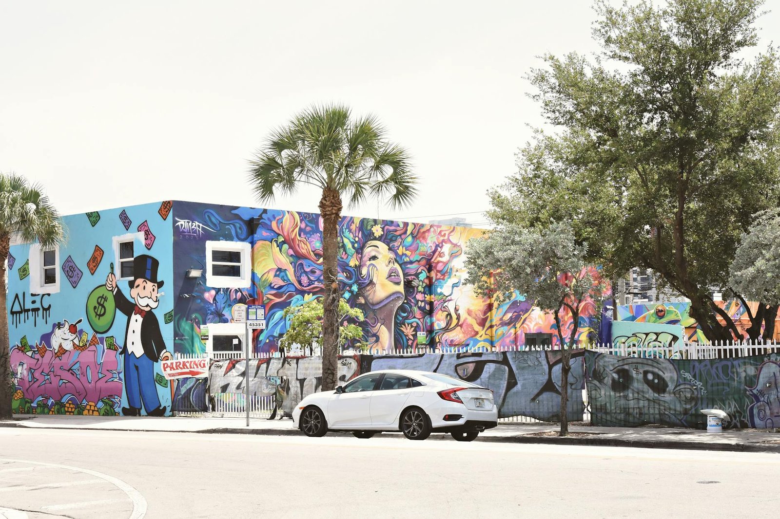 Colorful street art in Miami's urban environment featuring vivid graffiti and mural artwork.